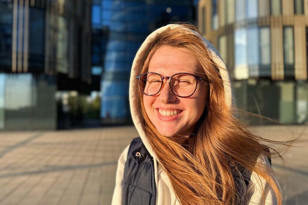 A teen smiles into the camera at sunset while learning about an ADHD Treatment Program