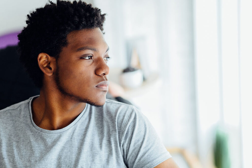 A young person looks off into the distance during ADHD help