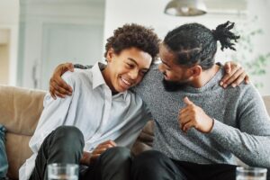 a parent hugs a teen after learning about Parent Mental Health Resources